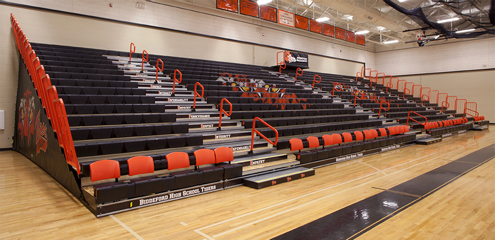 Hussey Seating Company retractable bleachers in a modern school gymnasium